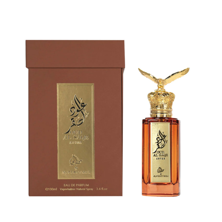 Perfume bottle with gold cap and packaging on a white background
